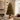 Porta albero di Natale elegante con doppia sfera decorativa in salotto luminoso