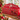 Calendario dell'Avvento in legno rosso con 25 cassettini numerati e decorazioni natalizie.