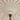 Dettaglio interno macramè geometrico di ombrellone boho chic con palo in legno inciso