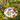 Piatto fondo Blossom con decorazione floreale multicolor e bordo arancione in stile estivo botanico