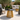 Tavolino da giardino design oro e nero in moderno angolo relax outdoor illuminato dal sole