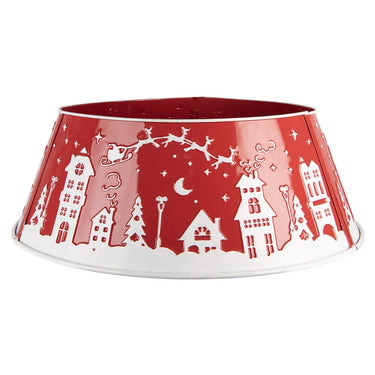 base rigida per albero di Natale in metallo rosso con trafori decorativi a tema natalizio, fotografata in una stanza elegante e luminosa