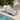 Lettino piscina azzurro ergonomico in ambiente outdoor moderno con piscina e luce naturale