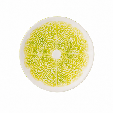 Piatto dessert tropicale con motivo agrume lime su fondo bianco
