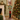 Schiaccianoci natalizio con tromba in verde e rosso alto 121 cm, ambientato in un elegante soggiorno con albero di Natale decorato