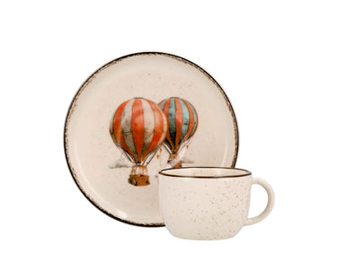 
Tazza da caffè in gres beige puntinato con manico laterale e bordo marrone anticato.


