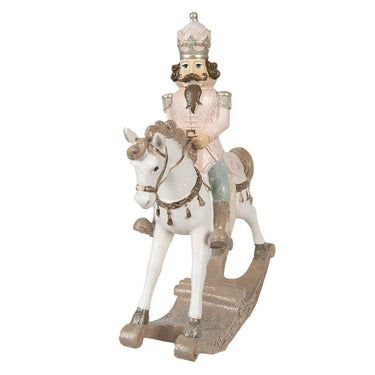 Schiaccianoci decorativo su cavallo a dondolo con dettagli rosa e dorati