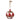 Grande ornamento natalizio rosso bianco e oro in ambientazione rustica luminosa
