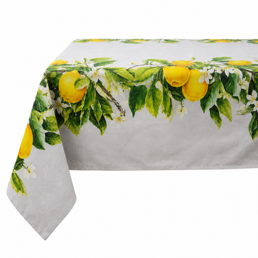 Tovaglia in cotone con stampa limoni gialli, foglie verdi e fiori bianchi su fondo chiaro.